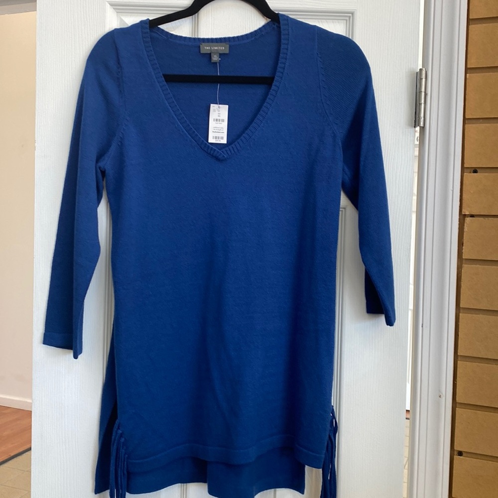 V Neck Sweater with tassel’s on the sides.